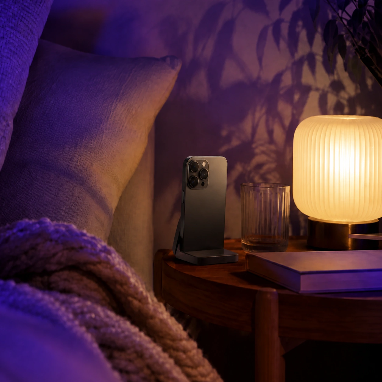 iPhone in a quiet purple-lit bedroom